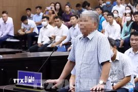 Bị cáo Lê Thanh Thản tại phiên xét xử năm 2023. (Ảnh: Phạm Kiên/TTXVN)