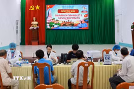Điểm thu mẫu sinh phẩm ADN thân nhân liệt sỹ chưa xác định thông tin tại xã Tháp Mười, tỉnh Đồng Tháp. (Ảnh: Nhựt An/TTXVN)