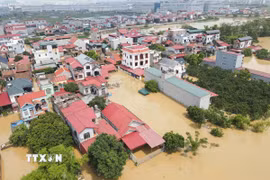 Nhiều khu vực của Bắc Ninh bị nước lũ bủa vây. (Ảnh: Thanh Thương/TTXVN)