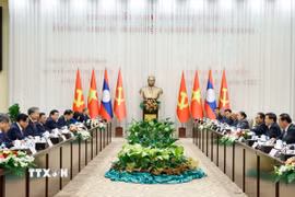 Tổng Bí thư Tô Lâm và Tổng Bí thư, Chủ tịch nước Lào Thongloun Sisoulith đồng chủ trì Cuộc gặp cấp cao giữa Đảng Cộng sản Việt Nam và Đảng Nhân dân Cách mạng Lào. (Ảnh: Thống Nhất/TTXVN)