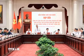 Phó Chủ nhiệm Văn phòng Chủ tịch nước Cấn Đình Tài chủ trì buổi họp báo. (Ảnh: An Đăng/TTXVN)