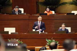 Thống đốc Ngân hàng Nhà nước Việt Nam Phạm Đức Ấn phát biểu giải trình, làm rõ một số vấn đề đại biểu Quốc hội nêu. (Ảnh: An Đăng/TTXVN)