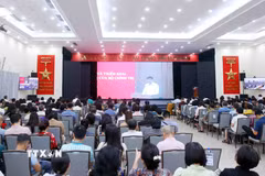Đảng viên thuộc Đảng bộ Thông tấn xã Việt Nam tham dự Hội nghị trực tuyến tại điểm cầu trụ sở Thông tấn Quốc gia (5 Lý Thường Kiệt, Hà Nội). (Ảnh: Phạm Kiên/TTXVN)