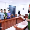 Thầy giáo bị bắt trong vụ gian lận thi Tốt nghiệp Trung học phổ thông tại Tuyên Quang. (Ảnh: TTXVN)