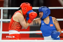 Võ sỹ boxing Lưu Diễm Quỳnh sẽ gặp võ sỹ Trung Quốc ở bán kết ASIAD 2026. (Ảnh: Hoàng Linh/TTXVN)