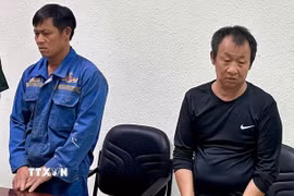 Các đối tượng tại Cơ quan Công an. (Ảnh: TTXVN phát)
