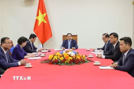 Thủ tướng Phạm Minh Chính điện đàm Thủ tướng Đức Friedrich Merz. (Ảnh: Dương Giang/TTXVN)