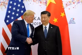 Tổng thống Mỹ Donald Trump (trái) và Chủ tịch Trung Quốc Tập Cận Bình. (Ảnh: Reuters/TTXVN)