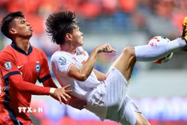 Đội tuyển Việt Nam sẽ quyết tâm vượt qua Singapore để giành vé vào chung kết AFF Cup 2024. (Ảnh: TTXVN phát)