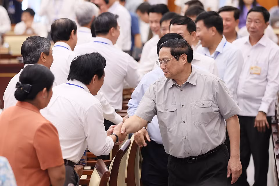 Thủ tướng Phạm Minh Chính với các đại biểu tham dự hội nghị Hội đồng Điều phối Vùng Đông Nam Bộ. (Ảnh: Dương Giang/TTXVN)