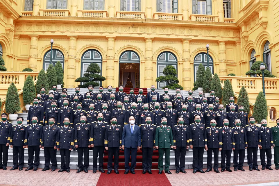 Chủ tịch nước Nguyễn Xuân Phúc với các đại biểu tại buổi gặp mặt. (Ảnh: Thống Nhất/TTXVN)
