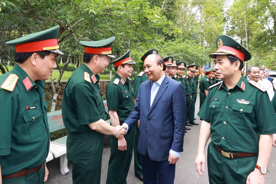 Chủ tịch nước Nguyễn Xuân Phúc với các đại biểu tham dự buổi lễ. (Ảnh: Thống Nhất/TTXVN)