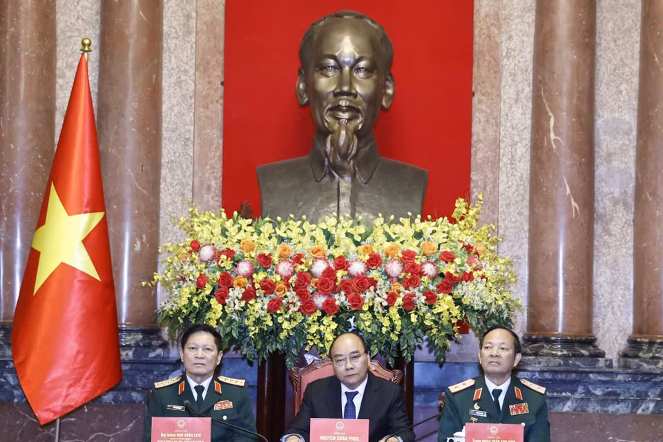 Chủ tịch nước Nguyễn Xuân Phúc chủ trì buổi gặp mặt. (Ảnh: Thống Nhất/TTXVN)