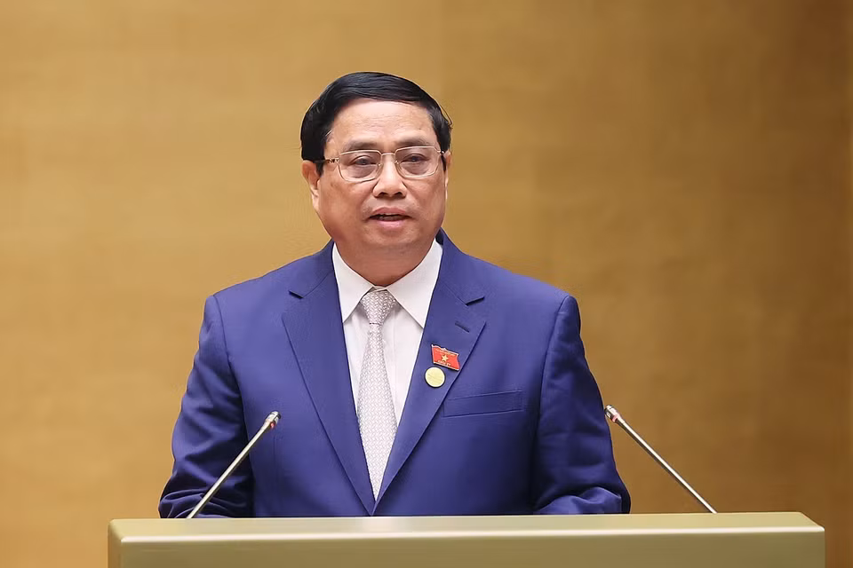 Thủ tướng Phạm Minh Chính trình bày Báo cáo Kết quả Thực hiện Kế hoạch Phát triển Kinh tế-xã hội năm 2023; Dự kiến Kế hoạch Phát triển Kinh tế-Xã hội năm 2024. (Ảnh: Dương Giang/TTXVN)