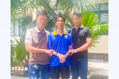 Đối tượng Hồ Như Ý bị bắt khi đang lẩn trốn. (Ảnh: TTXVN phát)