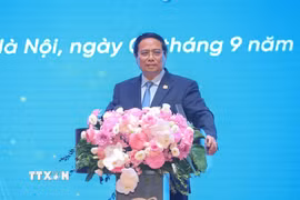 Thủ tướng Phạm Minh Chính phát biểu tại Lễ kỷ niệm 80 năm ngày truyền thống Tập đoàn Bưu chính Viễn thông Việt Nam (VNPT). (Ảnh: Dương Giang/TTXVN)