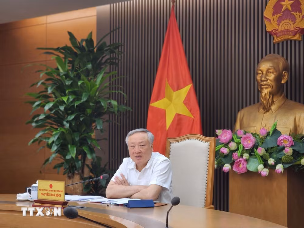 ttxvn-pho-thu-tuong-thuong-truc-nguyen-hoa-binh-hop-ve-trung-tam-tai-chinh-quoc-te-2210-2.jpg
