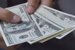 Đồng USD. (Ảnh: AFP/TTXVN)