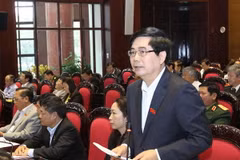 Bộ trưởng Bộ Nông nghiệp và Phát triển nông thôn Cao Đức Phát trả lời các câu hỏi của đại biểu Quốc hội. (Ảnh: Nhan Sáng/TTXVN)