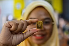 Vàng miếng được bán tại Sàn Giao dịch ở Kelantan, Malaysia. (Ảnh: AFP/TTXVN) 