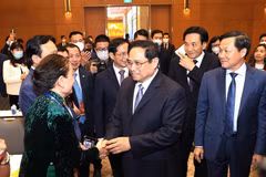 Thủ tướng Phạm Minh Chính với các đại biểu kiều bào dự Xuân quê hương năm 2022. (Ảnh: Dương Giang/TTXVN) 