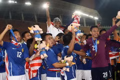 Niềm vui của các cầu thủ U23 Malaysia sau khi đoạt chức vô địch. (Ảnh: Quang Nhựt/TTXVN)