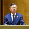 Bộ trưởng Bộ Tài chính Ngô Văn Tuấn, thừa ủy quyền của Thủ tướng Chính phủ trình bày tờ trình về dự án Luật Đấu thầu (sửa đổi). (Ảnh: TTXVN) 