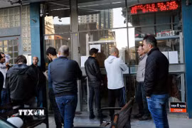 Một quầy giao dịch Bitcoin tại Tel Aviv, Israel. (Ảnh: THX/TTXVN)