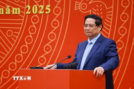 Thủ tướng Phạm Minh Chính chia sẻ với cộng đồng người Việt Nam tại Trung Quốc. (Ảnh: Dương Giang/TTXVN)