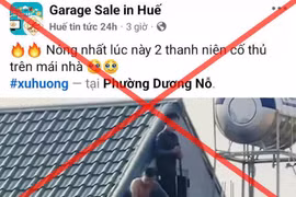 Trang Facebook "Huế tin tức 24h" đăng thông tin clip 2 người cố thủ trên mái nhà ở Thanh Hóa nhưng lại ghi địa điểm ở phường Dương Nỗ, thành phố Huế. (Ảnh chụp màn hình)