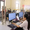 Sau một năm thực hiện mô hình chính quyền địa phương hai cấp, xã Việt Hồng tiếp nhận 5.484 hồ sơ, trong đó có 5.480 hồ sơ giải quyết trước hạn, đạt trên 99,9%. (Ảnh: Đinh Thùy/TTXVN)