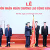 Tổng Bí thư Tô Lâm trao tặng Huân chương Lao động hạng Nhất cho ngành Văn hóa, Thể thao và Du lịch. (Ảnh: Thống Nhất/TTXVN)