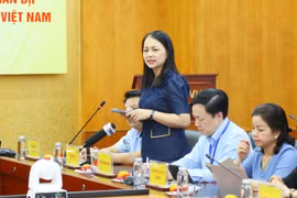 Bà Chu Thị Hạnh, Phó Cục trưởng Cục Việc làm (Bộ Nội vụ) chia sẻ thông tin tại buổi họp báo. (Ảnh: PV/Vietnam+)