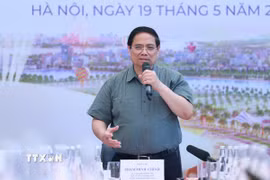 Thủ tướng Phạm Minh Chính làm việc với các bộ, ngành, nhà đầu tư và đơn vị thi công dự án Trung tâm Hội chợ Triển lãm Quốc gia. (Ảnh: Dương Giang/TTXVN)