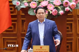 Thủ tướng Phạm Minh Chính chủ trì họp khắc phục hậu quả thiên tai sau bão. (Ảnh: Dương Giang/TTXVN)