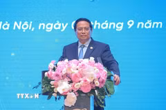 Thủ tướng Phạm Minh Chính phát biểu tại Lễ kỷ niệm 80 năm ngày truyền thống Tập đoàn Bưu chính Viễn thông Việt Nam (VNPT). (Ảnh: Dương Giang/TTXVN)