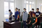 Các bị cáo tại phiên toà xét xử. (Ảnh: Phạm Kiên/TTXVN)