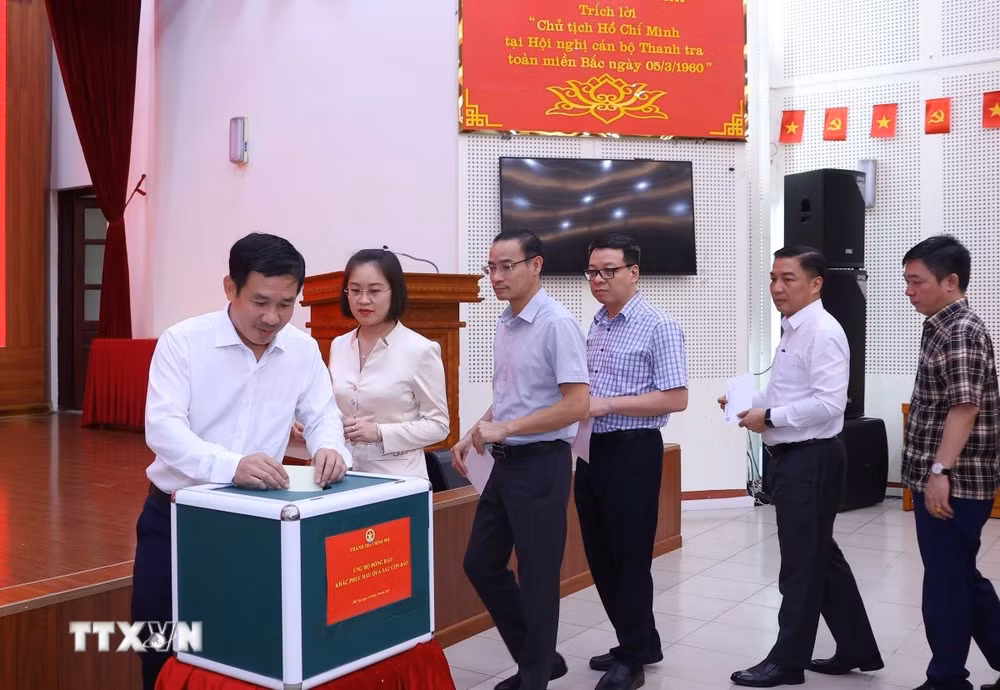 ttxvn-ung-ho-bao2.jpg