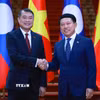 Thủ tướng Lê Minh Hưng và Thủ tướng Lào Saleumxay Kommasith chụp ảnh chung. (Ảnh: Dương Giang/TTXVN)