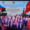 Các đại biểu tham dự Lễ khai mạc chụp ảnh lưu niệm. (Ảnh: Trần Hải/TTXVN)