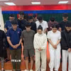 Các đối tượng tại cơ quan Công an. (Ảnh: TTXVN phát)