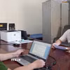 Đối tượng Ngô Đức Lượng tại cơ quan điều tra. (Ảnh: TTXVN phát)