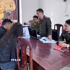 Trường hợp V.X.H làm việc với cơ quan công an. (Ảnh: TTXVN phát)