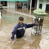 Nhiều nhà dân ở xã Hàm Thuận Bắc (tỉnh Lâm Đồng) bị ngập sâu. (Ảnh: Hồng Hiếu/TTXVN)