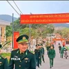 Cán bộ, chiến sỹ Đồn Biên phòng đảo Trần (Cô Tô) đi bầu cử. (Ảnh: TTXVN phát)