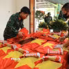 Tiến hành đánh giá tình trạng hài cốt, sau đó sẽ tiến hành lấy mẫu ADN để xác định danh tính liệt sỹ. (Ảnh: Hoàng Hiếu/TTXVN)