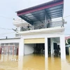 Theo báo cáo từ UBND xã Kim Tân, xã có 38/48 thôn với 2.235 hộ bị ngập, chính quyền địa phương đã huy động lực lượng sơ tán hơn 1.800 hộ dân với 7.600 nhân khẩu đến nơi an toàn. (Ảnh: Hoa Mai/TTXVN)