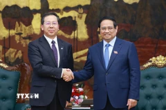 Thủ tướng Phạm Minh Chính tiếp ông Bành Cương Bình, Chủ tịch Công ty hữu hạn Tập đoàn Khoa học Kỹ thuật Hoa Điện Trung Quốc. (Ảnh: Dương Giang/TTXVN)