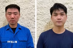 Đối tượng Zhang Chengrong và Nie Changao (từ trái qua phải). (Ảnh: TTXVN phát)