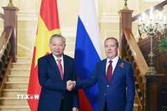 Tổng Bí thư Tô Lâm với Chủ tịch Đảng nước Nga Thống nhất, Phó Chủ tịch Hội đồng An ninh Liên bang Nga Dmitry Medvedev. (Ảnh: Thống Nhất/TTXVN)